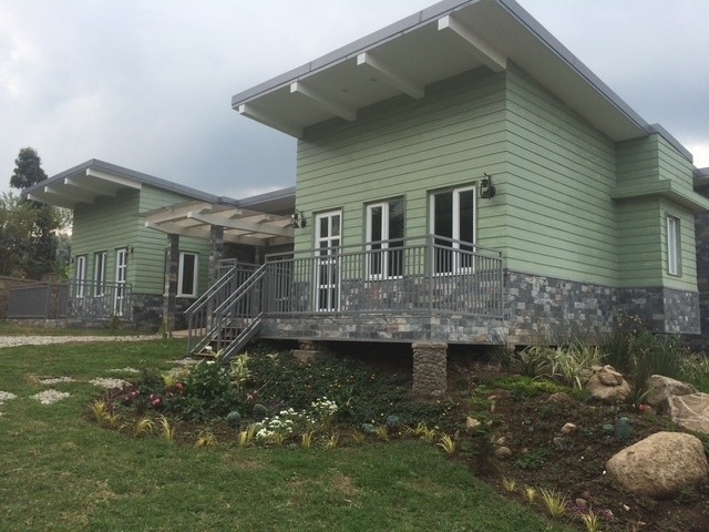 This was built using local labour and as much as possible locally sourced materials and tradesmen. Only one jcb was allowed to be used so that, whilst under construction, we did not scare the primates back into the forest which would have affected the tourism business as well as putting stress on the animals. The lodge units are operated by Rwanda Development Board.