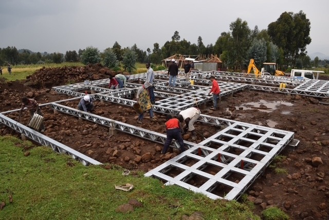 This was built using local labour and as much as possible locally sourced materials and tradesmen. Only one jcb was allowed to be used so that, whilst under construction, we did not scare the primates back into the forest which would have affected the tourism business as well as putting stress on the animals. The lodge units are operated by Rwanda Development Board.